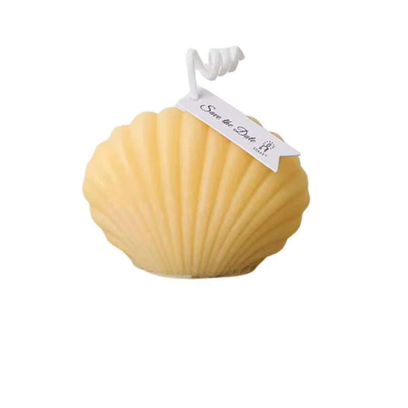 Свічка «Морська мушля» ручної роботи жовтого кольору